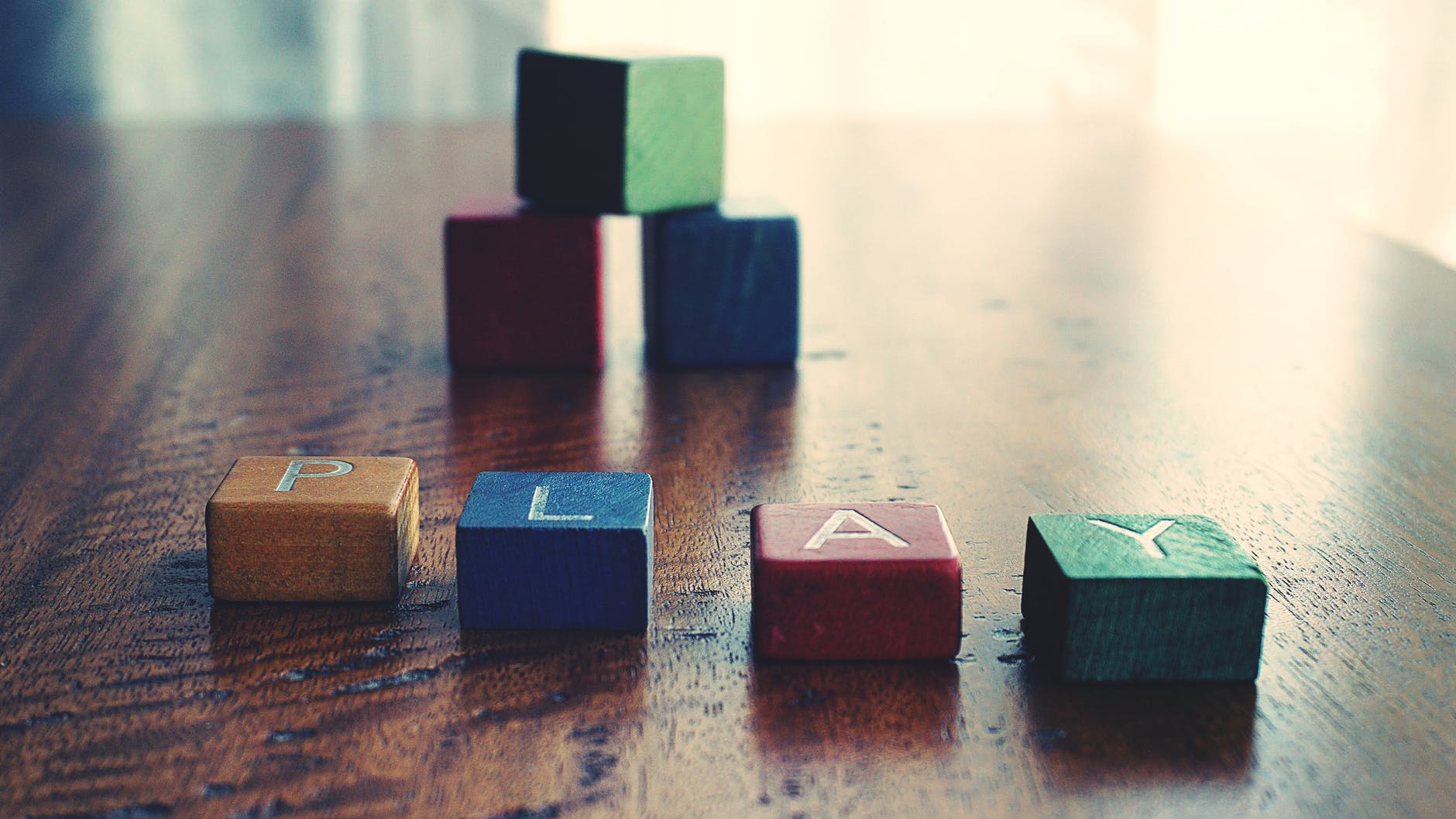 conceptual photo of word play spelled by wooden blocks